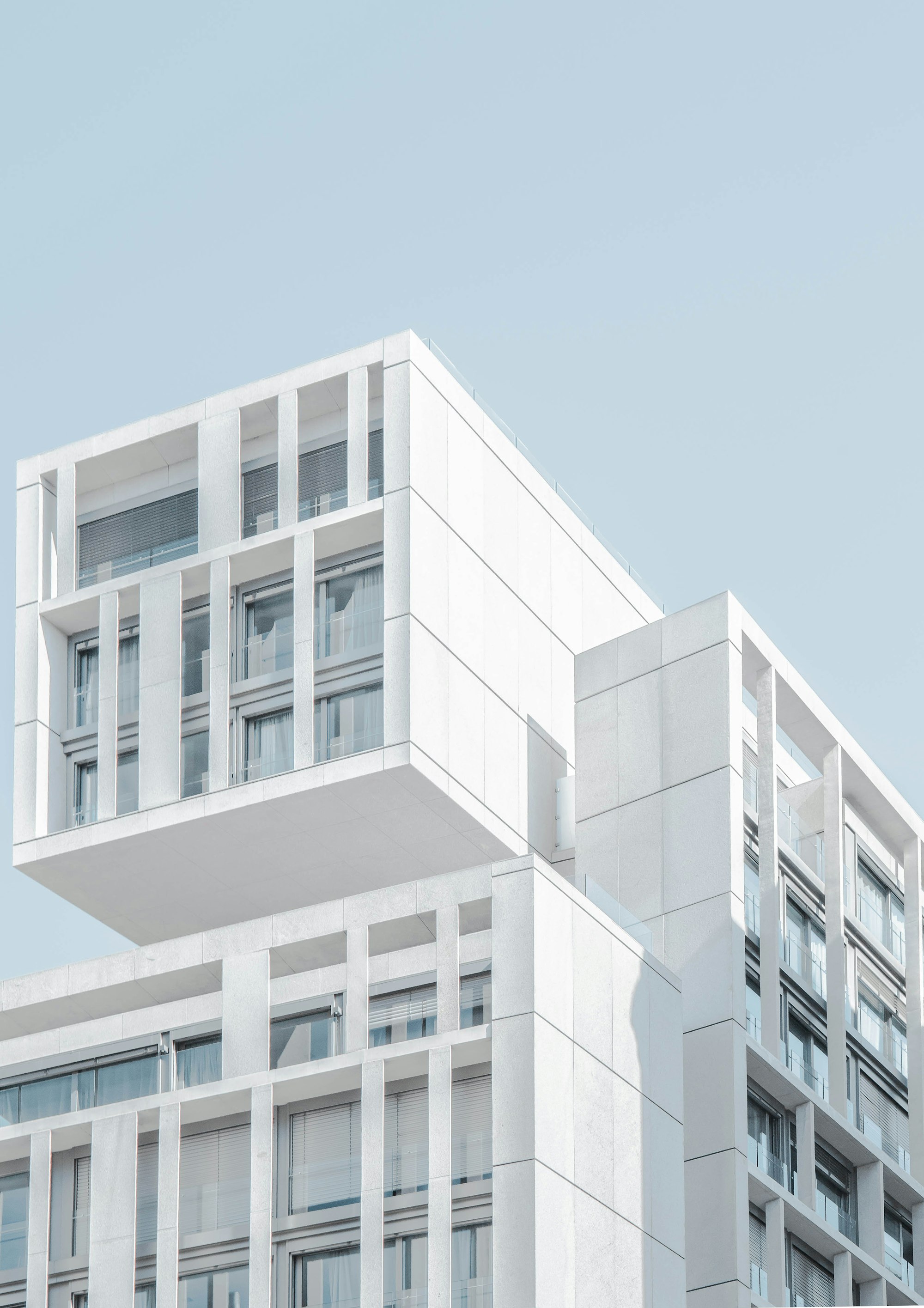 Generate an image of: Abstract architecture details, highly structured steel framing against a black background, industrial and severe
